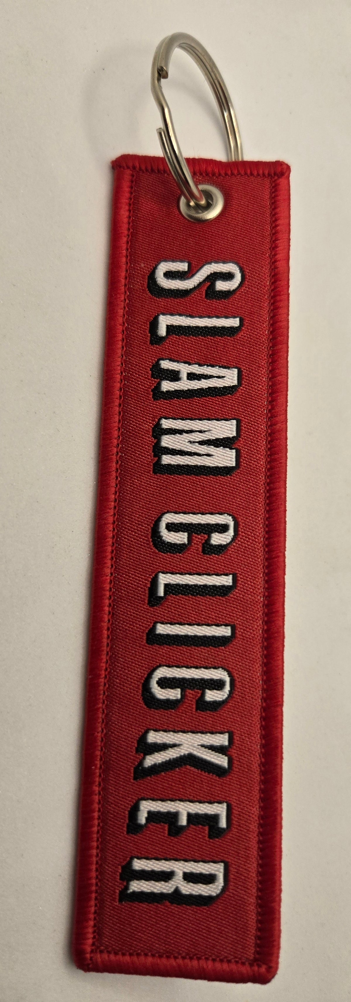 "SLAM CLICKER" bag tag