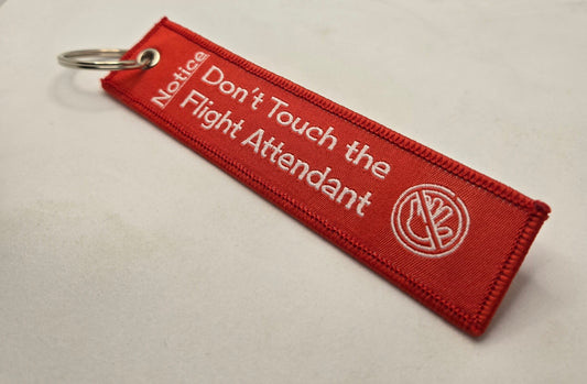 "DON'T TOUCH THE FLIGHT ATTENDANT" bag tag