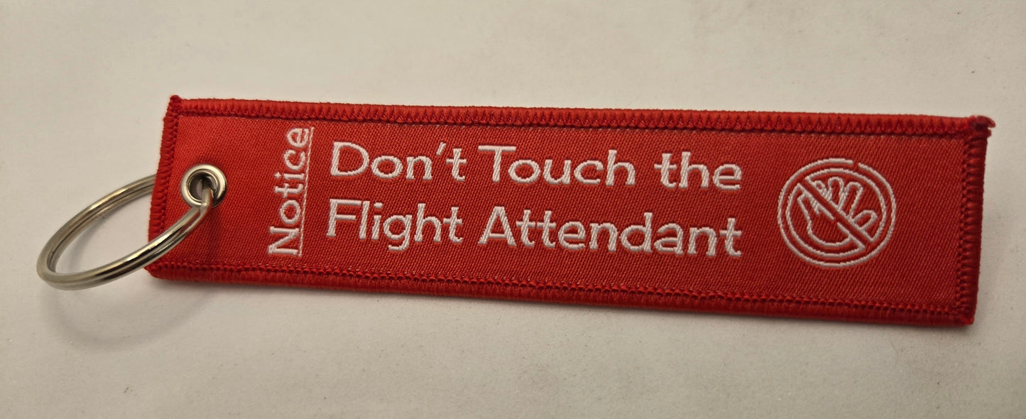 "DON'T TOUCH THE FLIGHT ATTENDANT" bag tag