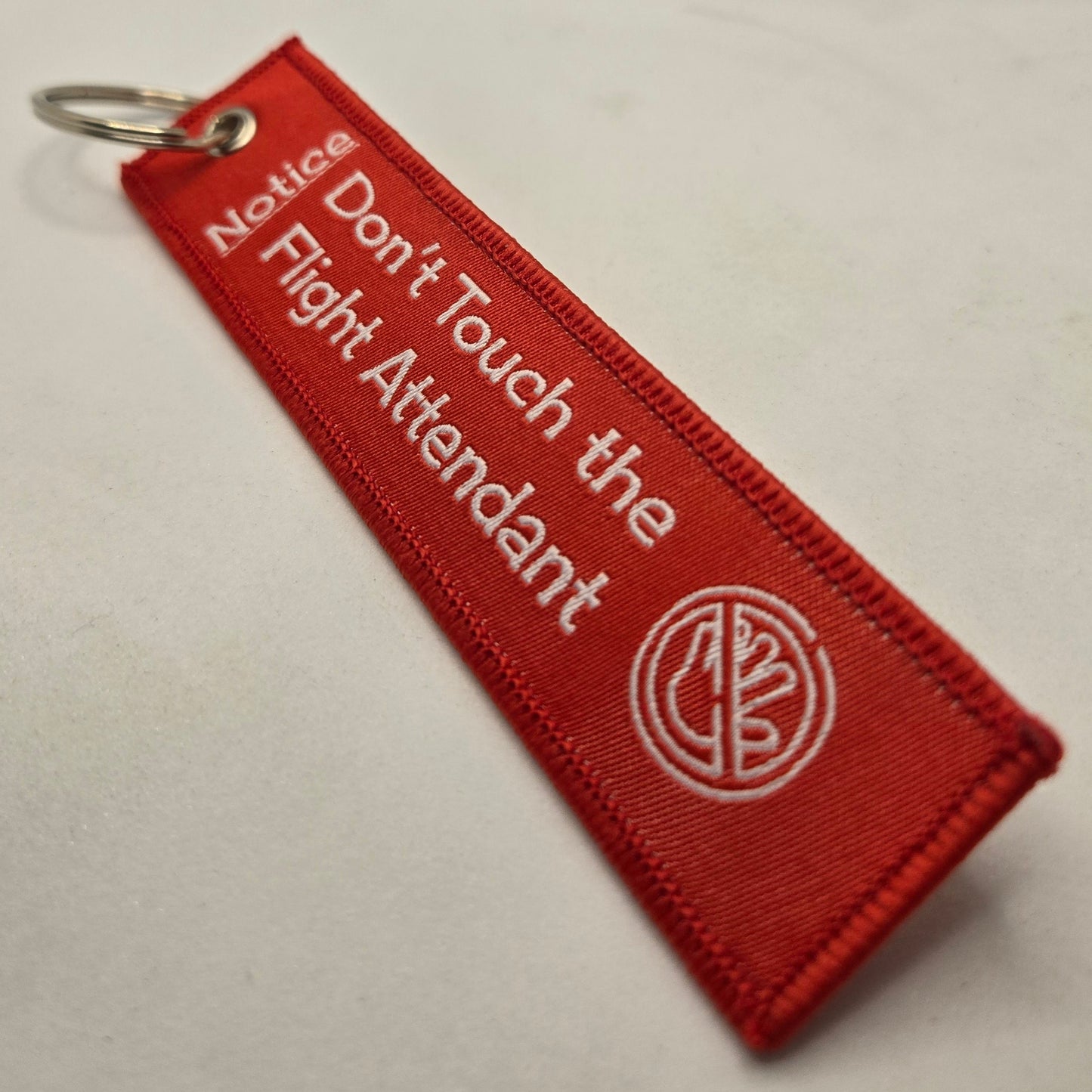 "DON'T TOUCH THE FLIGHT ATTENDANT" bag tag