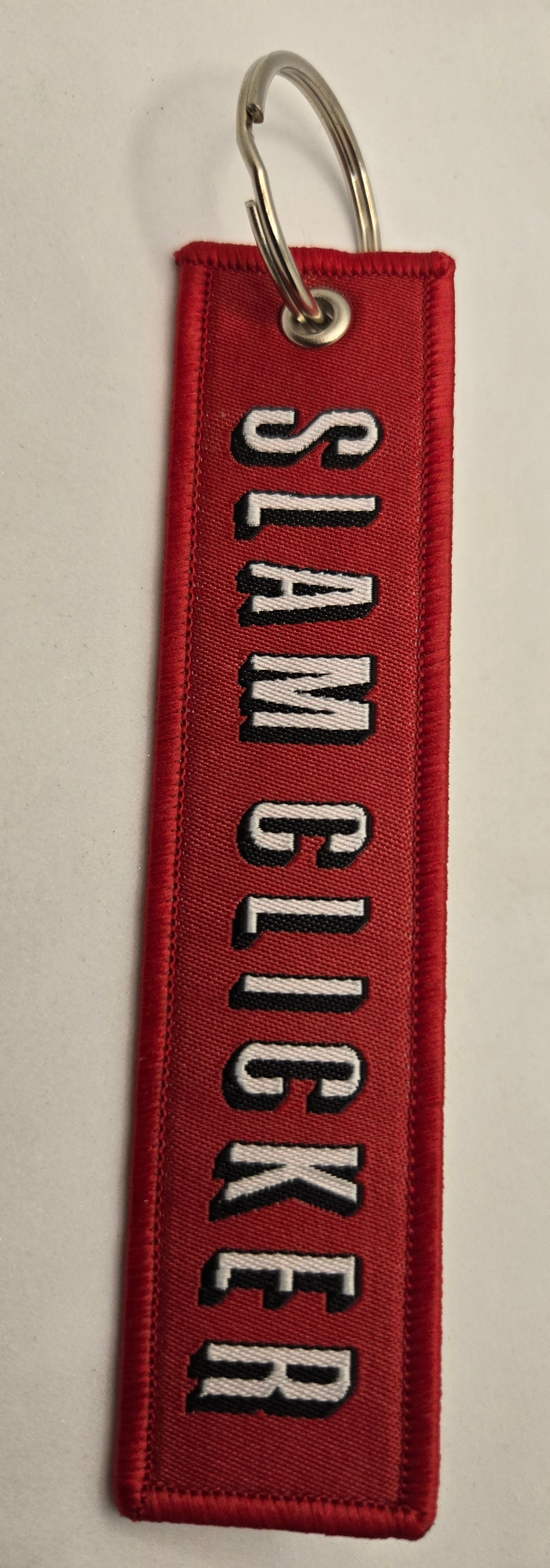 "SLAM CLICKER" bag tag