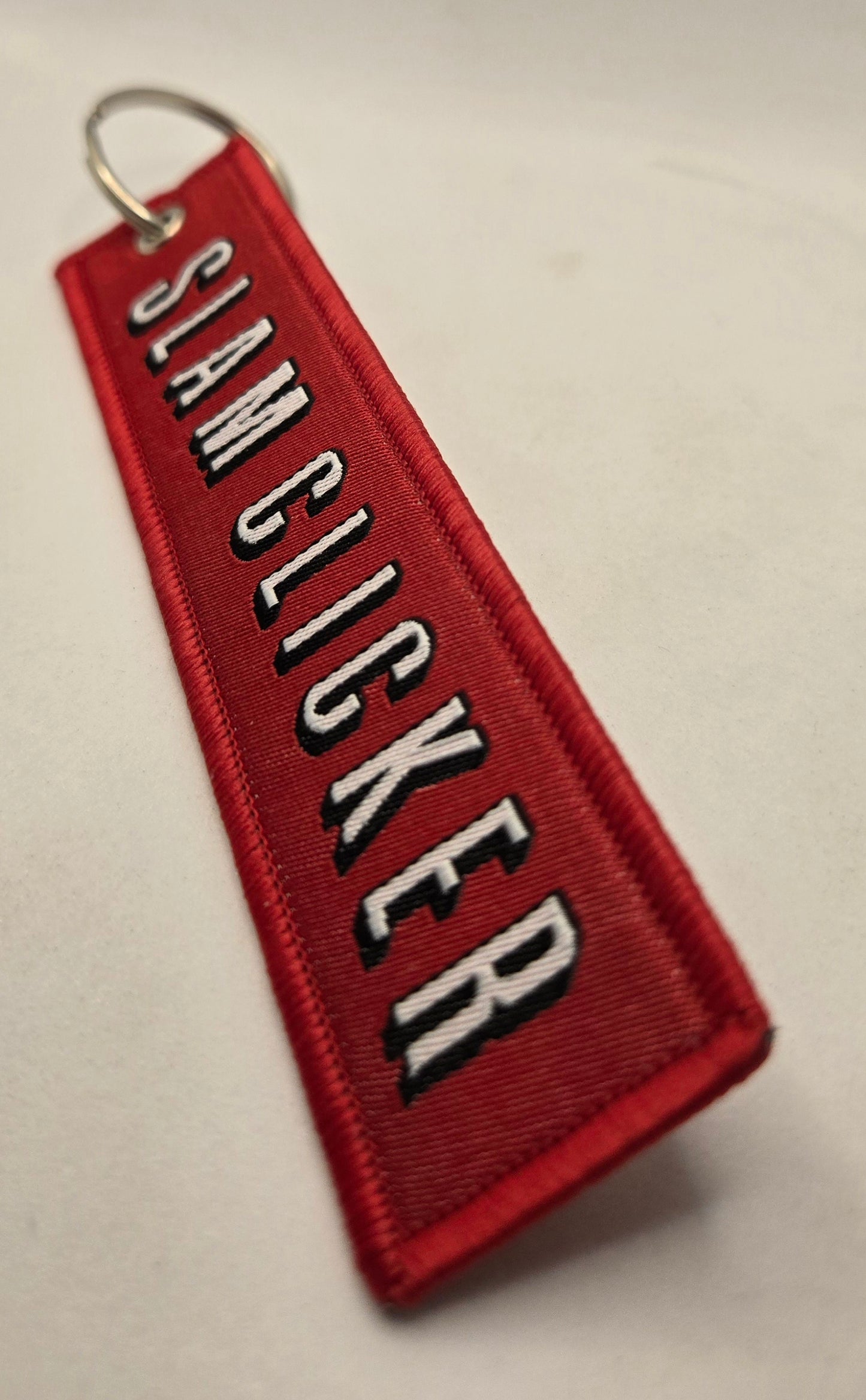 "SLAM CLICKER" bag tag